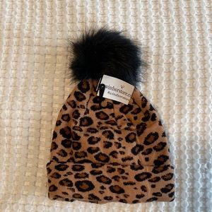Cheetah print hat with black fluff on top